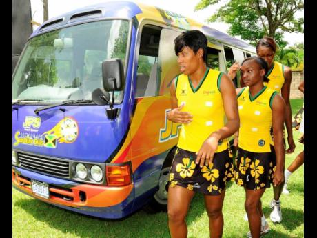 In this file photo from August 2010, Jamaica’s Sunshine Girls inspect their team bus at a ceremony for the handover of the vehicle.