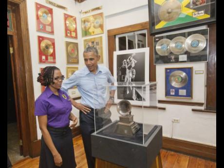 US President Barack Obama visits the Bob Marley Museum with tour guide Natasha Clark. Wednesday, April 8, 2015 in Kingston, Jamaica
