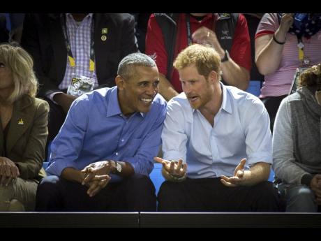 Former US President Barack Obama, centre left, and Britain’s Prince Harry watch wheelchair basketball at the Invictus Games in Toronto in September 2017. 