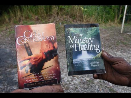 Two of the books which commune overseer Andre Buchanan says are used to guide their way of living.