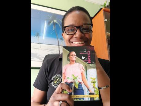 Breast cancer survivor Petre Williams Raynor with a copy of her book, titled ‘I Am Not My Breasts’,  which was recently published. 