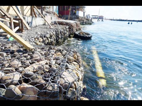 Shop owners at Hellshire Beach have installed gabion baskets in a bid to save their businesses from shoreline erosion.