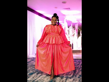 Jodian Pantry shows off her pink ensemble following a powerful performance on stage.