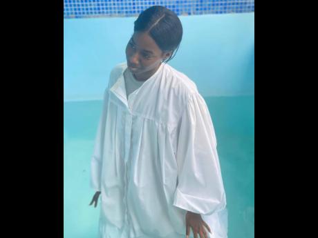 Abihail Myrie announced her baptism via Instagram, sharing the above image. 