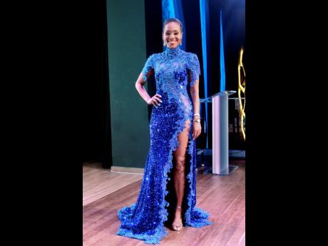 The host for the evening, Terri-Karelle Reid, bloomed in this blue Uzuri International dress. 