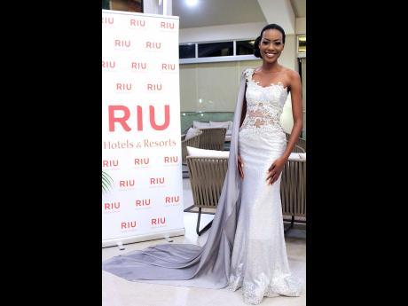 Top five finalist and winner of the sectional award for Best In Evening Wear, Kim-Marie Spence, was stunning in this silver gown from the Dermoth Williams Couture collection.