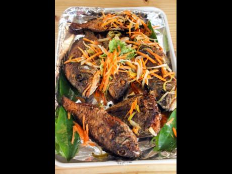  An assortment of freshly caught fish, fried and covered with the escoveitched peppers, onions and carrots. 