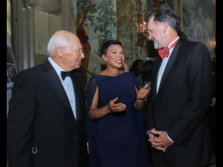 Jamaica’s Ambassador to the United States Audrey Marks, is flanked by real estate developer Albert Dwoskin (left) and Guy Stuart, owner of Half Moon at the English Ball. 