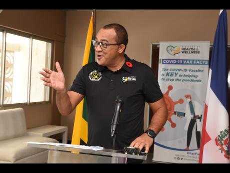 Minister of Health and Wellness Dr Christopher Tufton addressing a handover ceremony during which 50,000 doses of AstraZeneca vaccine were gifted to Jamaica by the Dominican Republic on Saturday.