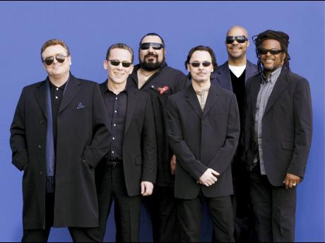 UB40 was formed in Birmingham, England in the late 1970s. Terence ‘Astro’ Wilson (right), joined in 1979, and left years later in 2013 to join up with former UB40 members Ali Campbell and Mickey Virtue.