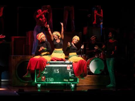 Sophia Mackay as Judy Mowatt (left), Gabrielle Brooks as Rita Marley (centre), Melissa Brown Taylor as Marcia Griffiths (right) are the I Threes in the West End musical, Get up, Stand Up!