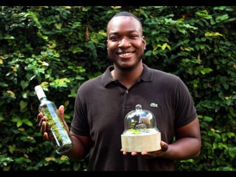 Thirty-year-old Gregory Ivey takes pride in his bottle terrariums because it contributes to building environmental sustainability. 