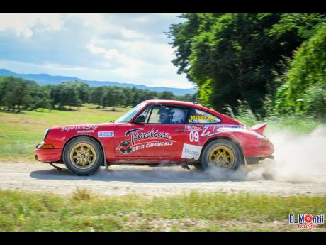 Hamilton and Harold Morley attacking the rally stage in their weapon of choice, a Porsche 911 rally car.