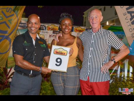 Co Driver Terry Hamilton and veteran driver Harold Morley receiving their car number for a Rally Jamaica staging.
