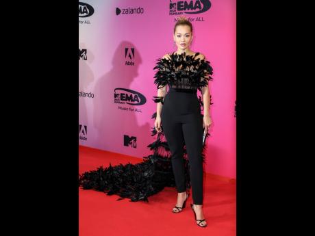 Rita Ora poses for photographers at the European MTV Awards. 