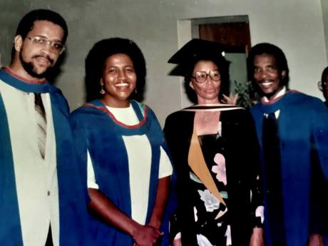 Dr Euna Moore (second right) and a few of her students at a graduation at UWI, Cave Hill. 