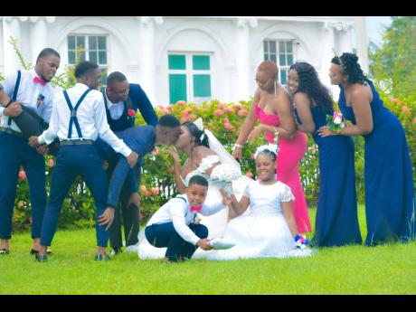 The supportive Grant-Reid bridal party got festive during the official wedding photo shoot. 