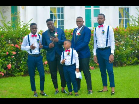 Dawneric (second left) is surrounded by his groomsmen – Matthew Grant (left); best man Donnar Reid (second right); Akeem Clarke (right) and ring boy Kyhmani Grant. 