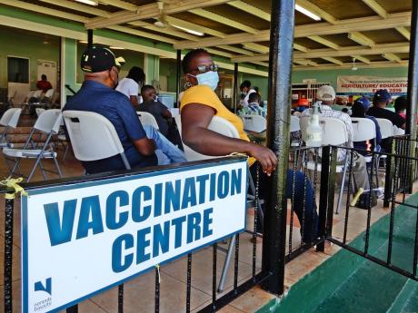 Persons wait to receive their vaccines during Noranda’s second vaccination drive held on Monday.