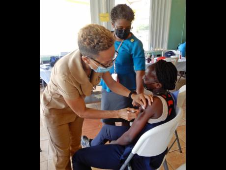 Sherieka Gibbs getting her first dose of the vaccine during Noranda’s vaccination drive.