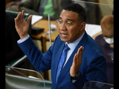 Prime Minister Andrew Holness announces a relaxation in COVID-19 measures during his address in the House of Representatives on Tuesday. 