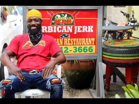 Donovan Anthony Morgan, or ‘DJ Raddington’, is the face of the Barbican Jerk & Vegetarian Restaurant waiting to fill orders and educate customers on Rastafarian culture. 