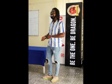 Recording artiste and songwriter Yaksta cracks a smile during the Dragon Be The One reasoning session held at the Twickenham Park Training Centre on Wednesday.