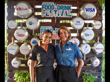 Nicole Pandohie (left), Jamaica Food & Drink Festival (JFDF) director, and Nasma Chin, festival manager, are all smiles as they pose for a picture at the JFDF launch.