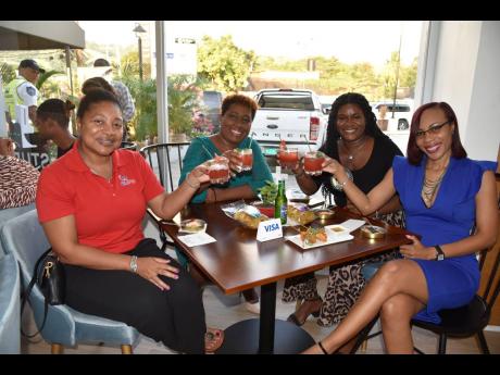 Cheers! From left: Nicola Watson, commercial manager of Gas Pro; Stephanie McCook-McGibbon, deputy managing director of OGM Integrated Communications Ltd; Orphia Johnson, digital manager of OGM Integrated Communications Ltd, and Kenesha Thomas, director of