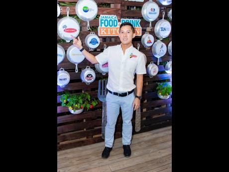 Reppin’ the brand. Craig Hendrickson, director of sales and marketing at National Baking Company, proudly showing off his companies logo in the decor of the Jamaica Food & Drink Festival launch.