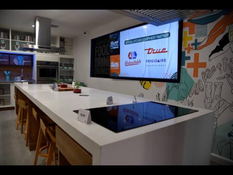 Inside the Jamaica Food and Drink Festival’s ‘experience kitchen’ which boasts a gourmet market, mixology counter, fully equipped studio kitchen and entertainment deck .