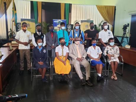 Local Government Minister Desmond McKenzie (front row, centre), poses with youth mayors at the Trelawny Municipal Corporation in Falmouth on Tuesday.
