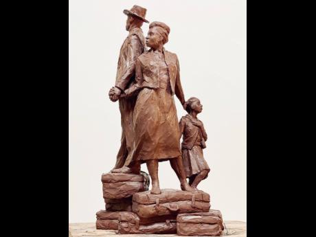 The maquette of Watson’s Windrush Monument shows three figures – man, woman and child – dressed in their Sunday best, climbing a mountain of suitcases hand in hand.
