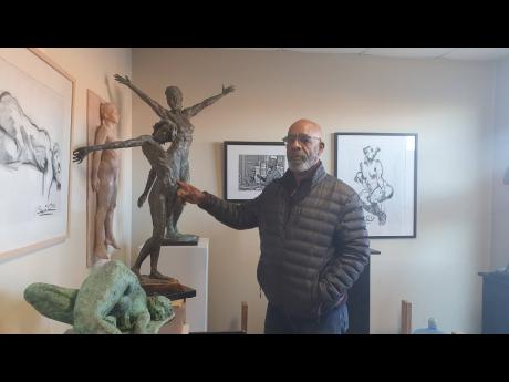 Renowned Jamaican artist and sculptor Basil Watson stands inside his studio in Lawrenceville, Georgia, in the United States. 