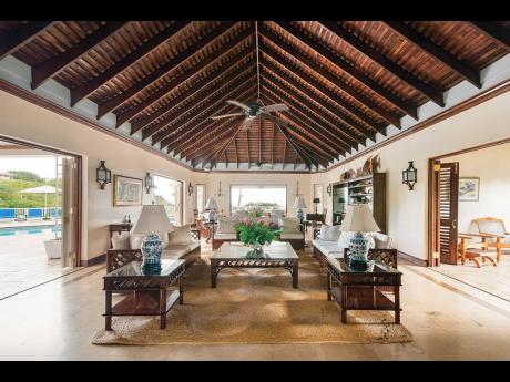 The grand living area, opening to the pool and Caribbean Sea.