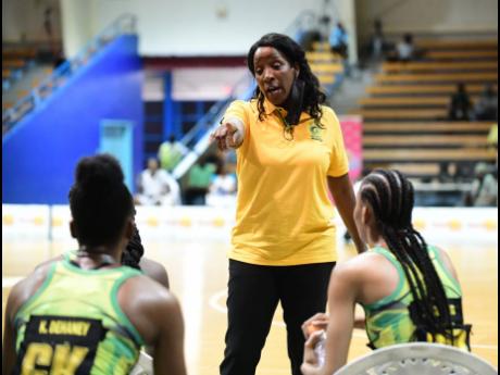 
Jamaica’s senior netball coach, Connie Francis (centre), addresses Kadie-Ann Dehaney (left) and Shamera Sterling during their recent tri-series against Trinidad and Tobago at the National Indoor Sports Centre. The Sunshine Girls will take on England Ros