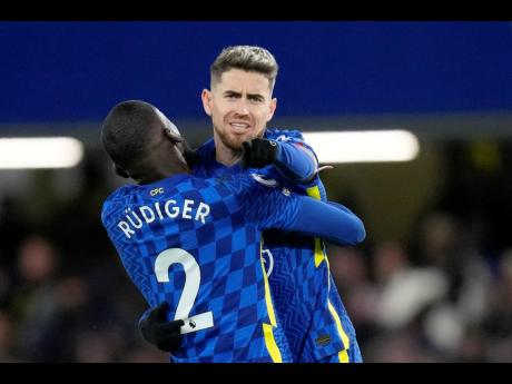 Chelsea goalscorer Jorginho celebrates with teammate Antonio Rüdiger after scoring a penalty during their English Premier League 1-1 draw with Manchester United at Stamford Bridge in London, England, yesterday.