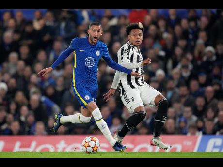 Chelsea’s Hakim Ziyech is challenged by Juventus’ Weston McKennie (right) during their UEFA Champions League group H match at Stamford Bridge in London, England on Tuesday.
