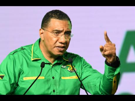 Jamaica Labour Party leader Andrew Holness speaks during the party’s 78th annual conference at the National Indoor Sports Centre on Sunday.