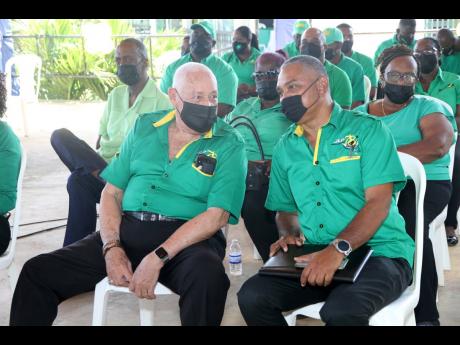 Lester Michael Henry (left), MP for Clarendon Central, and Michael Stern, of Area Council Three, in discussion during the JLP’s 78th annual conference location at the Denbigh Showground in Clarendon on Sunday.