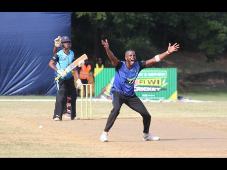 Fairfield United’s Leighton Leslie (right) appeals for one of his three wickets in the SDC T20 final at Noranda Cricket Ground in Discovery Bay, St Ann, yesterday.