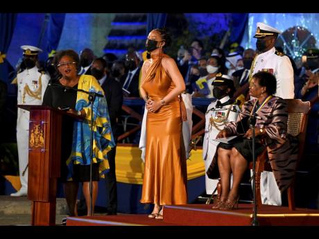 Barbados’ Prime Minister Mia Mottley (left) and President Dame Sandra Mason (right) honour superstar Rihanna as a national hero during the presidential inauguration ceremony in Bridgetown, Barbados, on Tuesday. Barbados has stopped pledging allegiance to