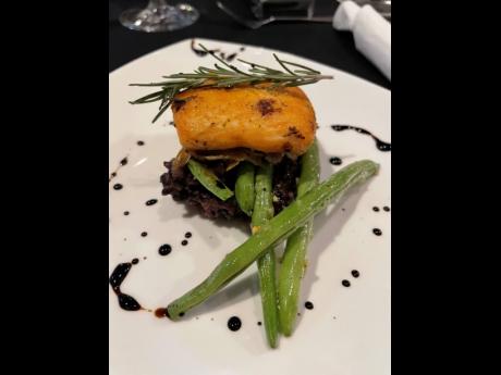 Roasted salmon, with a rosemary balsamic reduction, served with a comforting black rice pudding and cracked pepper buttered green beans that teamed impeccably with a Santa Margherita Rosé. PHOTO BY 