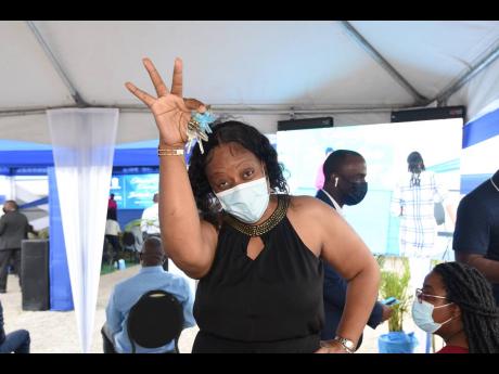 Suzette Kelly is overjoyed after receiving the keys to her new home at the newly constructed Twickenham Glades, located at Twickenham Park, St Catherine, on Wednesday. She received her keys during a handover ceremony hosted by the National Housing Trust.