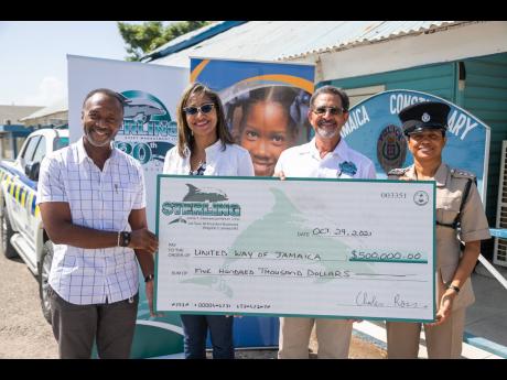 From left: Wayne Wray, board of governors, United Way of Jamaica; Stephanie Coy, chief executive officer, United Way of Jamaica; Charles Ross, chairman, president & CEO of Sterling Asset Management; Keisha M Scott, deputy superintendent of police, Area 4 C