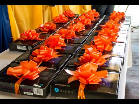 Twenty Azpen 10.1” Android tablets were distributed to grades seven and 10 students of the Tivoli Gardens High School last Tuesday. 