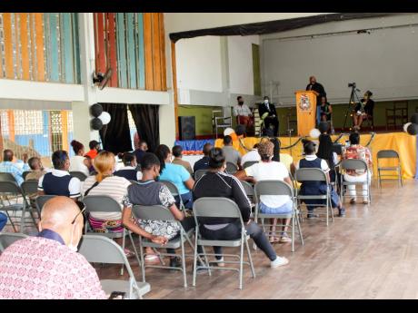 Cleve ‘Lt Stitchie’ Laing addresses the parents, students and staff during the handover ceremony. 