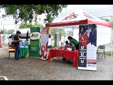 A Jamaica AIDS Support for Life booth at JN+ vaccination drive and health fair at Trevennion Park Road.
