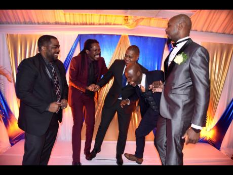 Steve Billings (left), chairman of Sun City, looks on at the antics of (from second left) Senator Damion Crawford; Floyd Green, St Elizabeth South West member of parliament; Marlon Campbell; and Otis Hamilton, president of the Jamaica Association of Insura