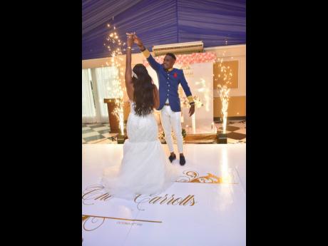 The newly-weds share their first official dance as husband and wife. The groom surprised his bride with flares to add magic and excitement to the dance floor.  
